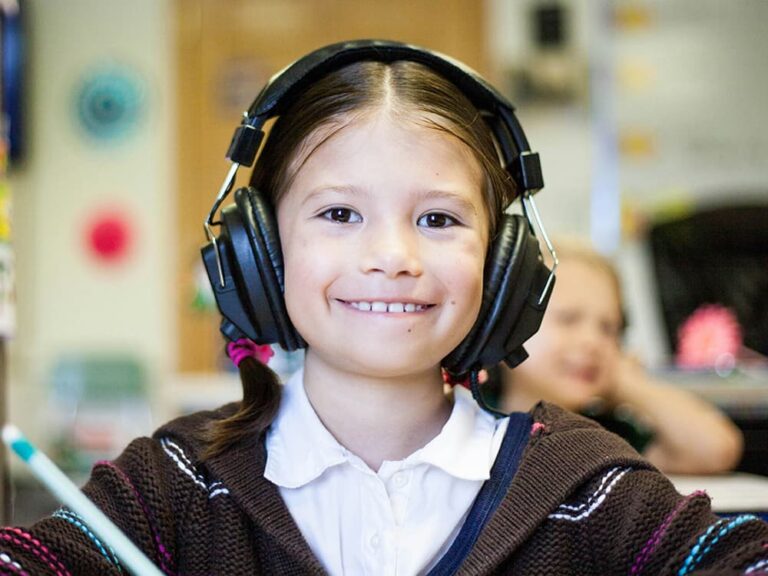 Child using headphones as part of a sensory regulation activity
